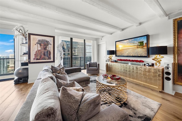 living room featuring wood-type flooring and beamed ceiling