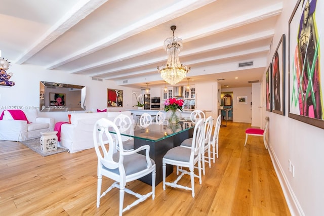 dining room with a chandelier, light hardwood / wood-style floors, and beam ceiling