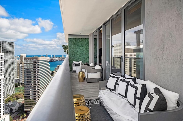 balcony featuring a water view