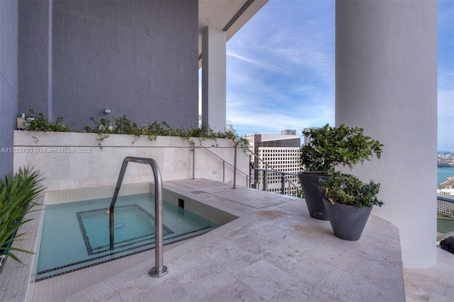 view of pool with a water view