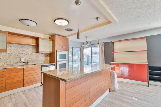 kitchen featuring white double oven, light wood-style flooring, visible vents, open shelves, and tasteful backsplash