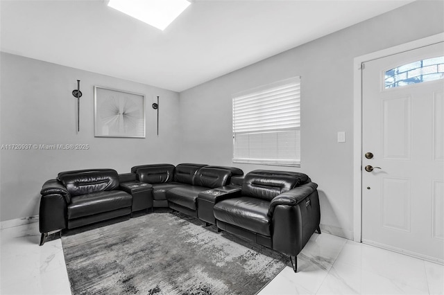 cinema room featuring a wealth of natural light