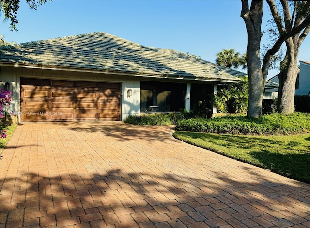 ranch-style house featuring a garage