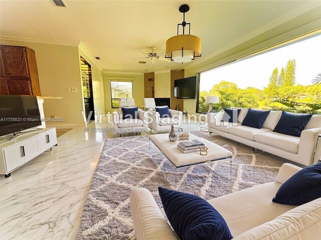 1 E Balfour Rd E, Palm Beach Gardens, FL 33418 - living room featuring crown molding, ceiling fan, and light marble finish flooring