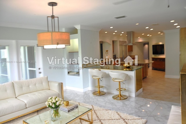 1 E Balfour Rd E, Palm Beach Gardens, FL 33418 - living area featuring crown molding, recessed lighting, arched walkways, and light marble finish flooring