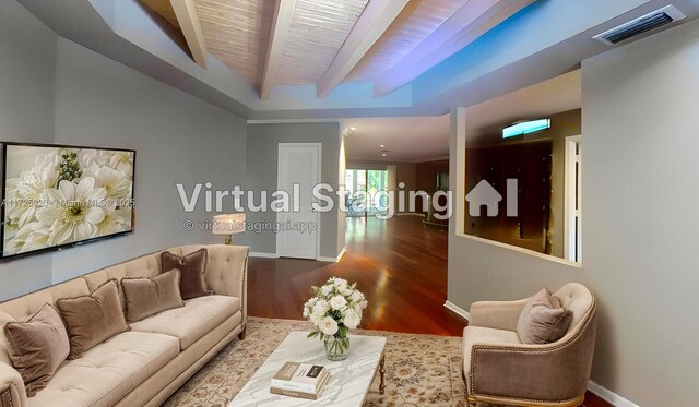 1 E Balfour Rd E, Palm Beach Gardens, FL 33418 - living room with beamed ceiling and wood finished floors