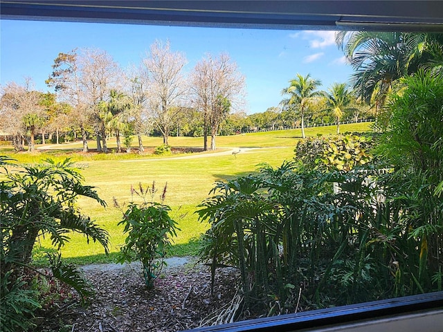 1 E Balfour Rd E, Palm Beach Gardens, FL 33418 - view of grassy yard with golf course view and view of wooded area