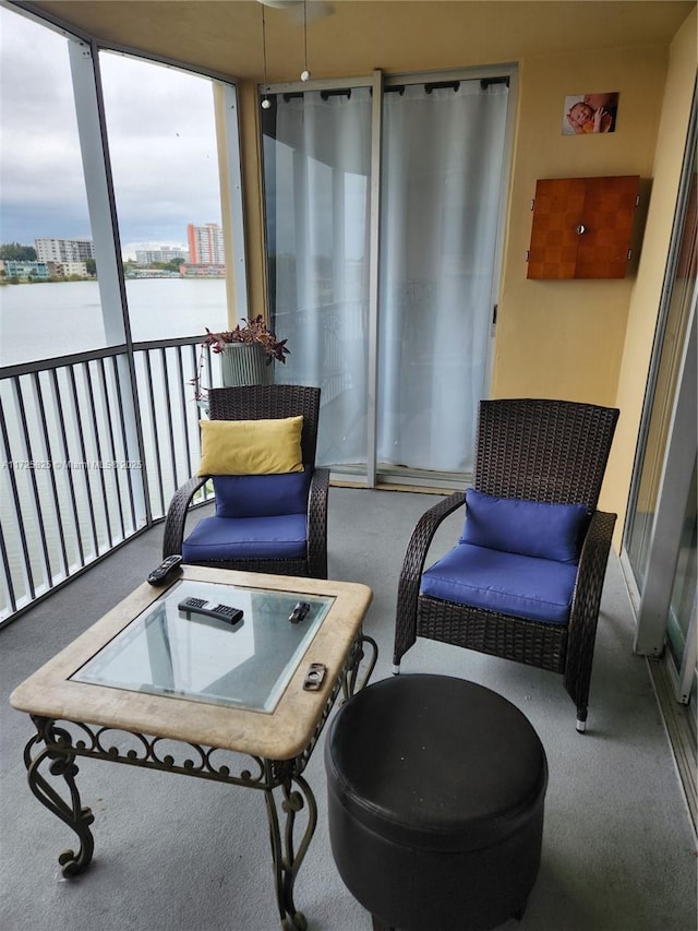 interior space with carpet flooring and a water view