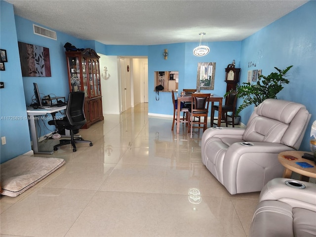 living room featuring a textured ceiling