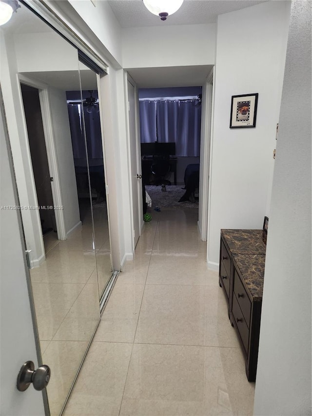 hallway with light tile patterned flooring