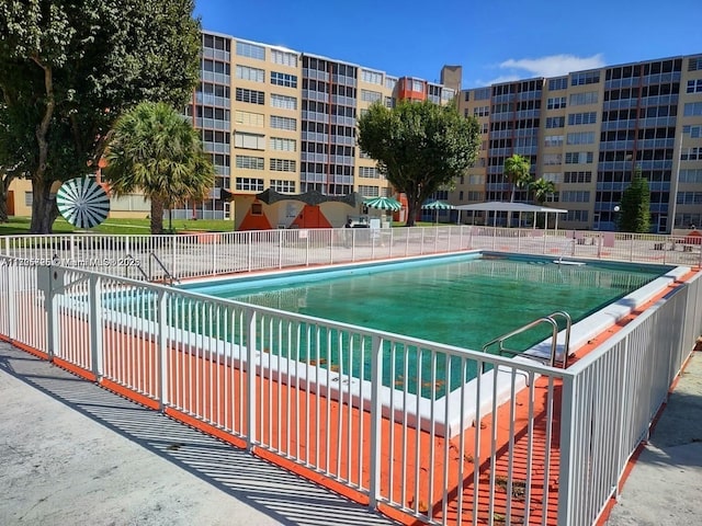 view of swimming pool with a patio