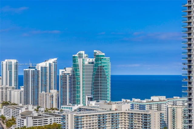 property's view of city featuring a water view