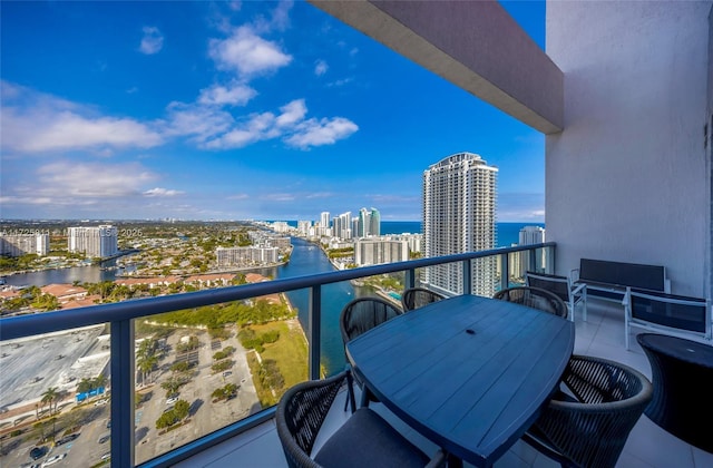 balcony with a city view and a water view