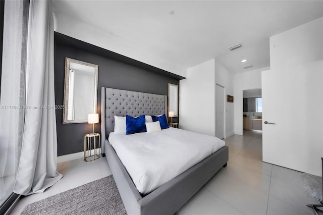 bedroom with tile patterned flooring, baseboards, and visible vents