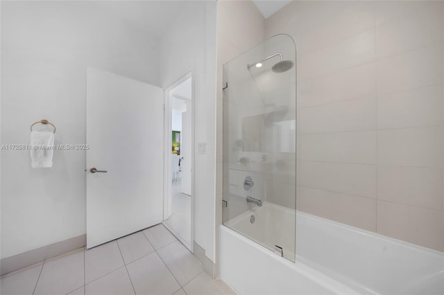 full bath with tile patterned floors, baseboards, and  shower combination