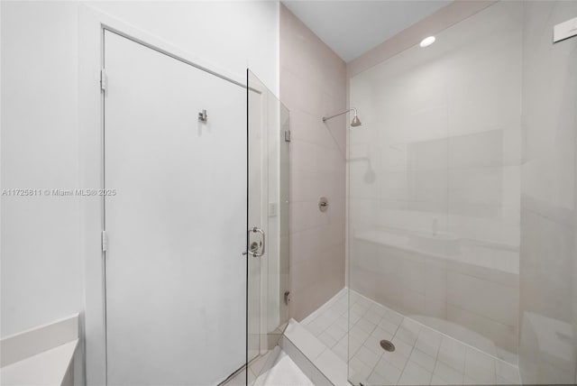 bathroom with a shower stall