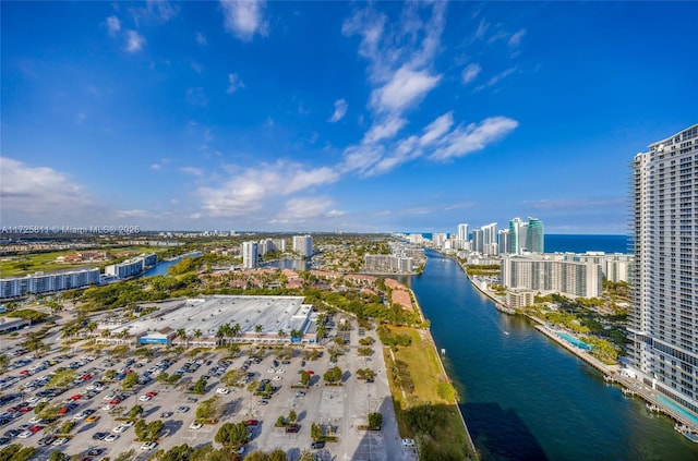 drone / aerial view with a view of city and a water view