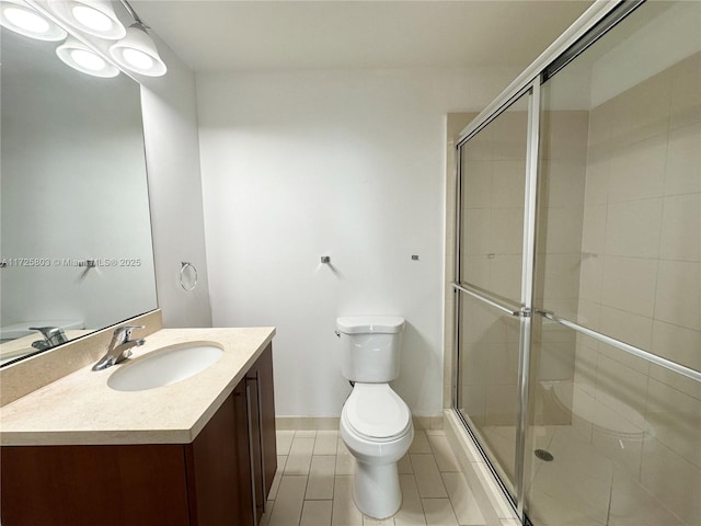 full bath with toilet, vanity, baseboards, and a shower stall