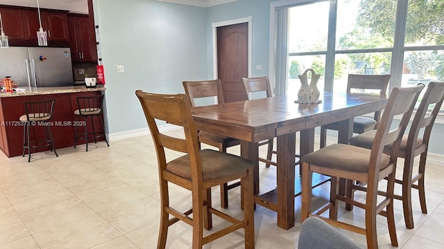 tiled dining area with crown molding