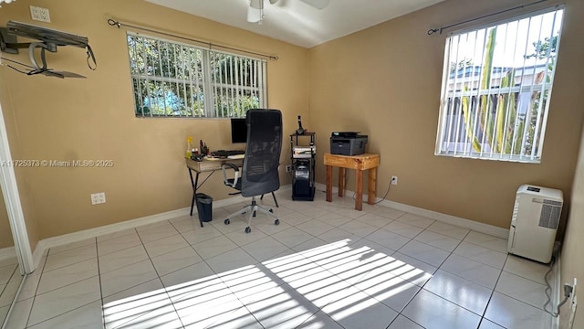 tiled office featuring ceiling fan