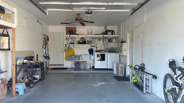 garage featuring ceiling fan, a garage door opener, and washing machine and clothes dryer