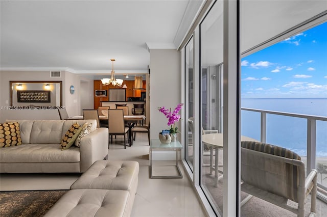 living room featuring visible vents, an inviting chandelier, floor to ceiling windows, a water view, and crown molding