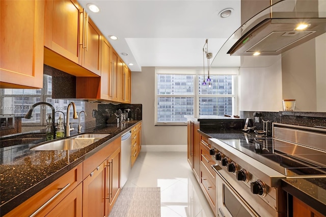 kitchen with light tile patterned flooring, stainless steel appliances, dark stone counters, and decorative light fixtures