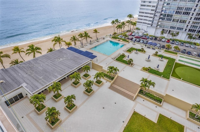 aerial view with a water view and a view of the beach