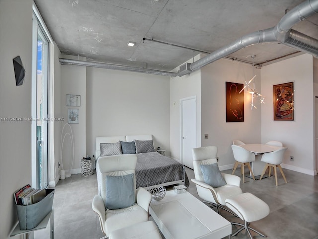 bedroom featuring concrete flooring