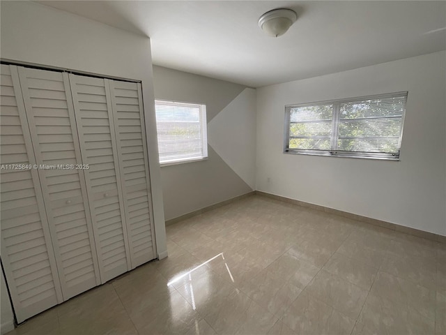 unfurnished bedroom with a closet