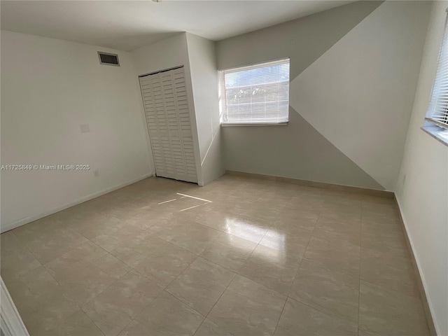 unfurnished bedroom with a closet