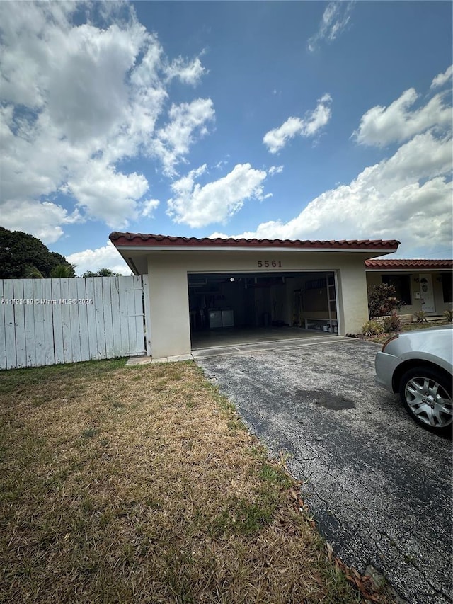 garage with a yard