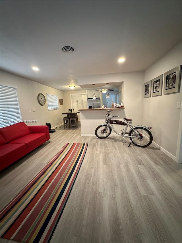 unfurnished living room with wood-type flooring