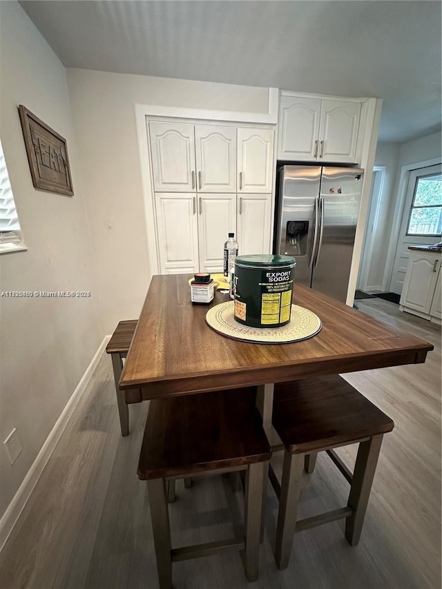 dining space featuring hardwood / wood-style floors