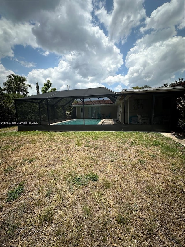 view of yard featuring glass enclosure