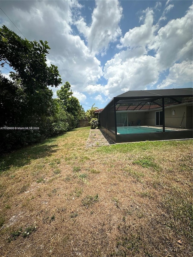 view of yard with a lanai