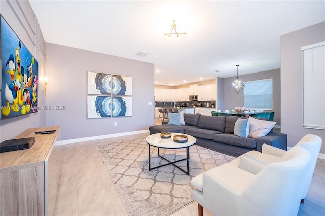 living room with a notable chandelier