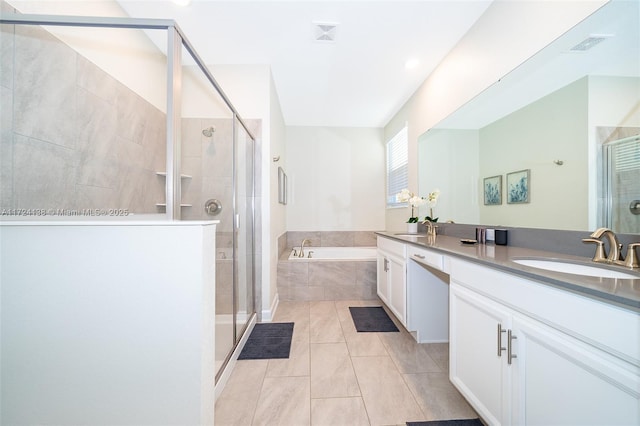 bathroom featuring vanity, separate shower and tub, and tile patterned floors