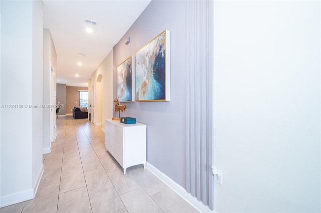 hallway with light tile patterned floors