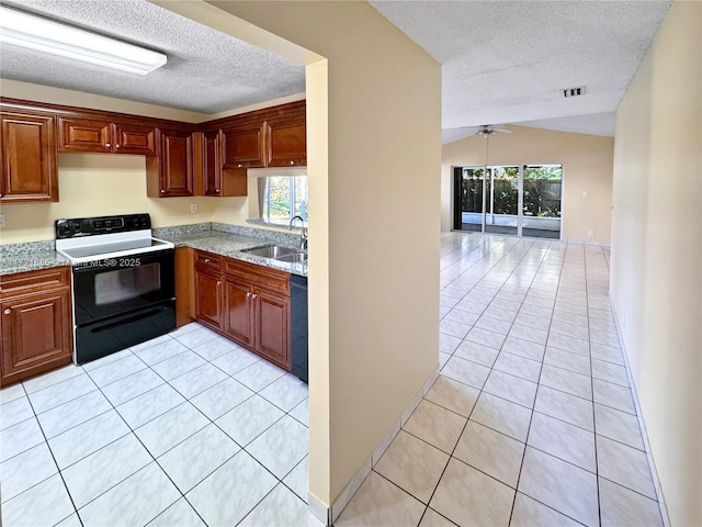 kitchen with black appliances, light tile patterned floors, a textured ceiling, lofted ceiling, and sink