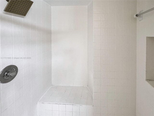 bathroom with tiled shower