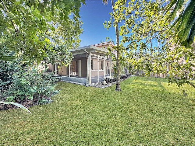 view of yard featuring a sunroom