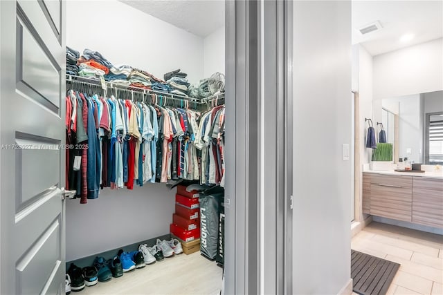 walk in closet with visible vents