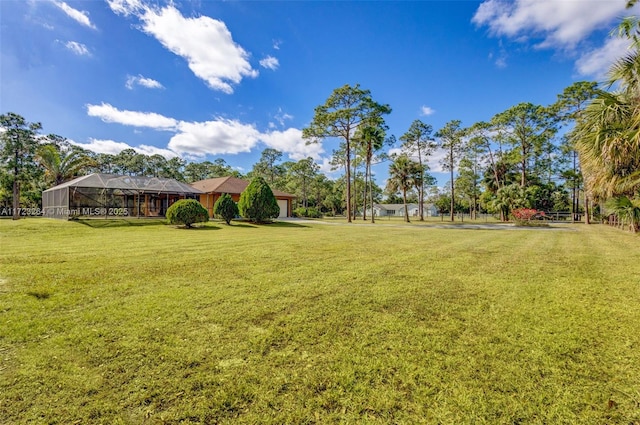 view of yard with a lanai