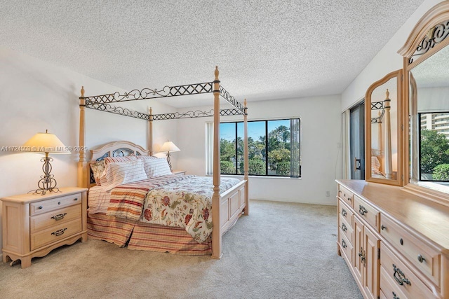 carpeted bedroom with a textured ceiling