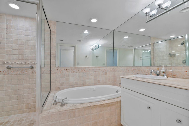 bathroom with vanity and plus walk in shower