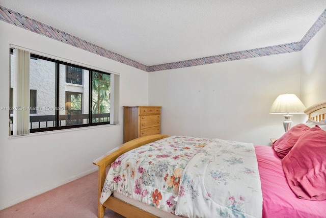 carpeted bedroom with a textured ceiling