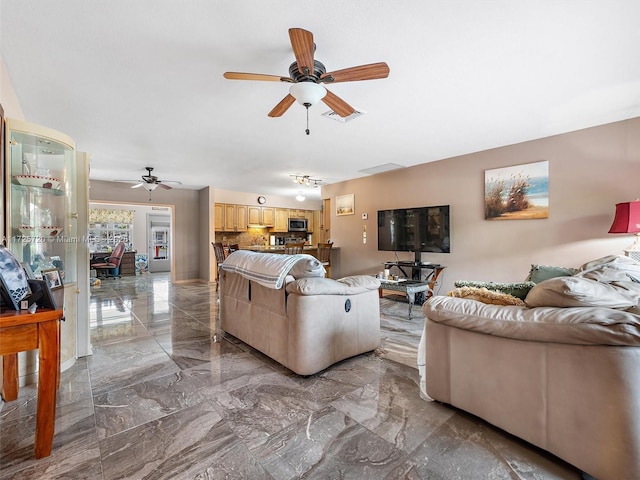 living room with ceiling fan