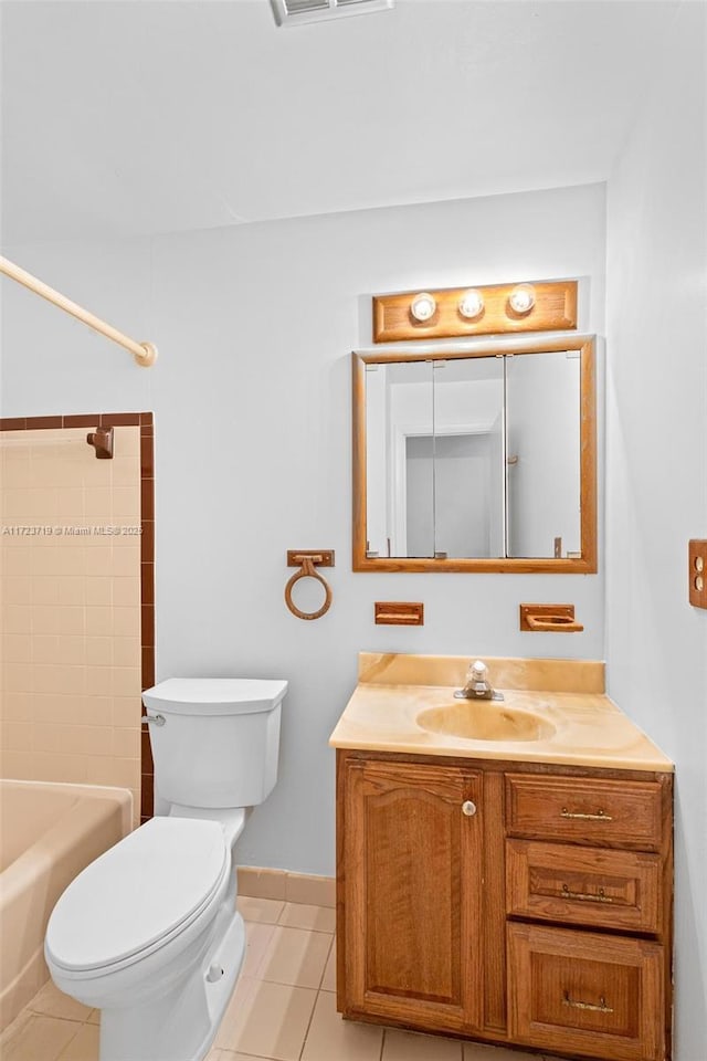 full bathroom with toilet, tiled shower / bath combo, tile patterned floors, and vanity