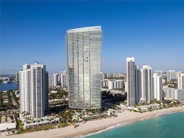 property's view of city featuring a beach view and a water view